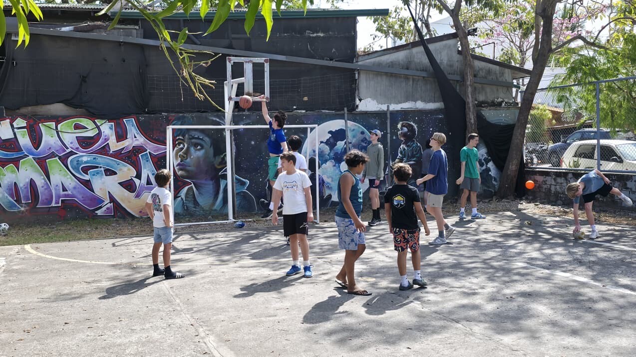 Playing basketball with kids at the school