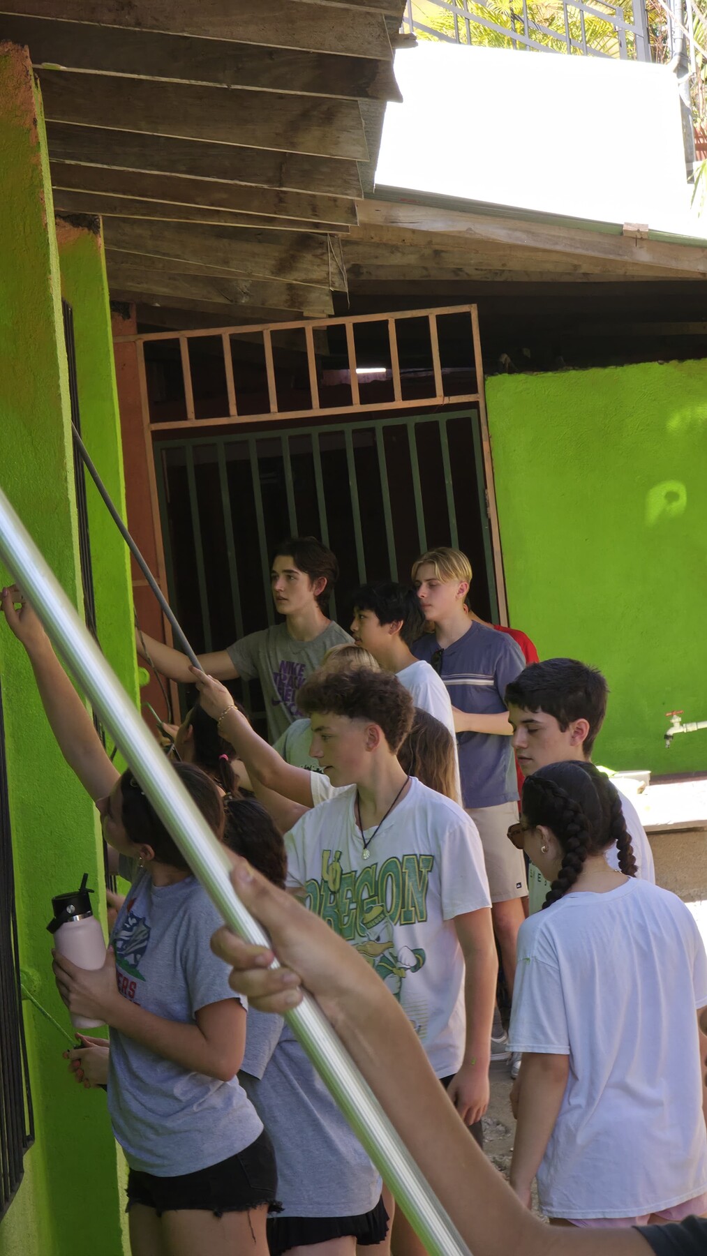 Students helping with roof work at the church
